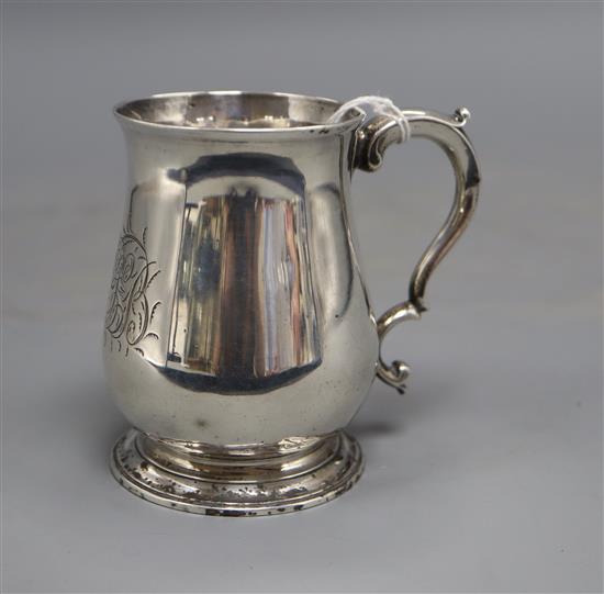 An early George III small silver baluster mug, with later engraved monogram, William Cripps, London, 1761, 9.3cm, 5.5 oz.